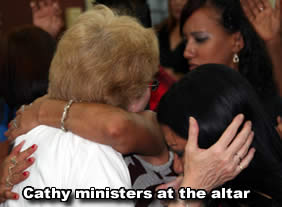 Cathy ministers at the altar